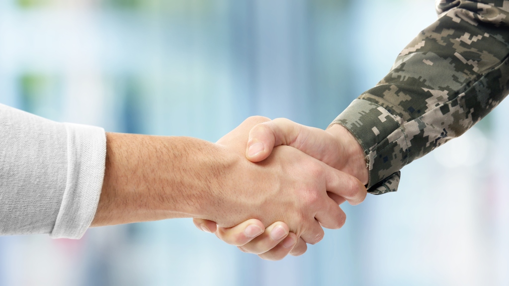 veteran shaking hands