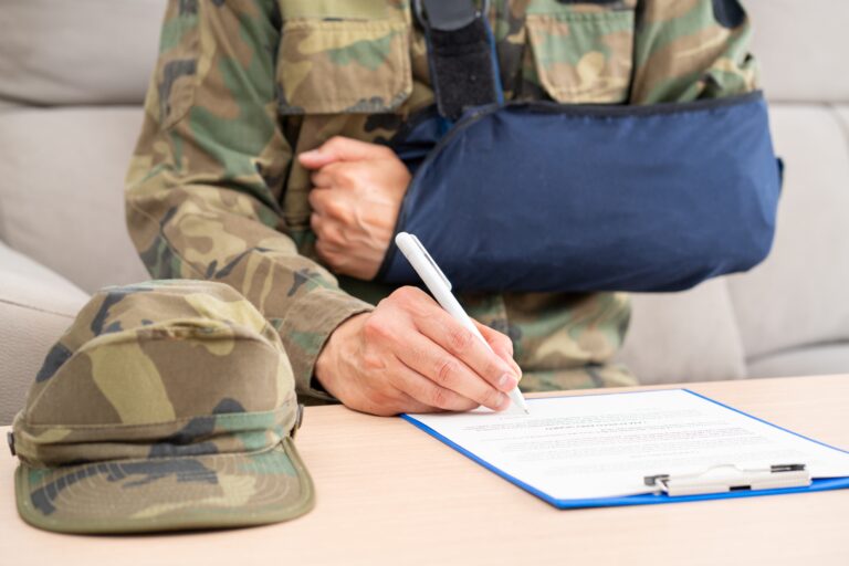 veteran filing out forms with broken arm