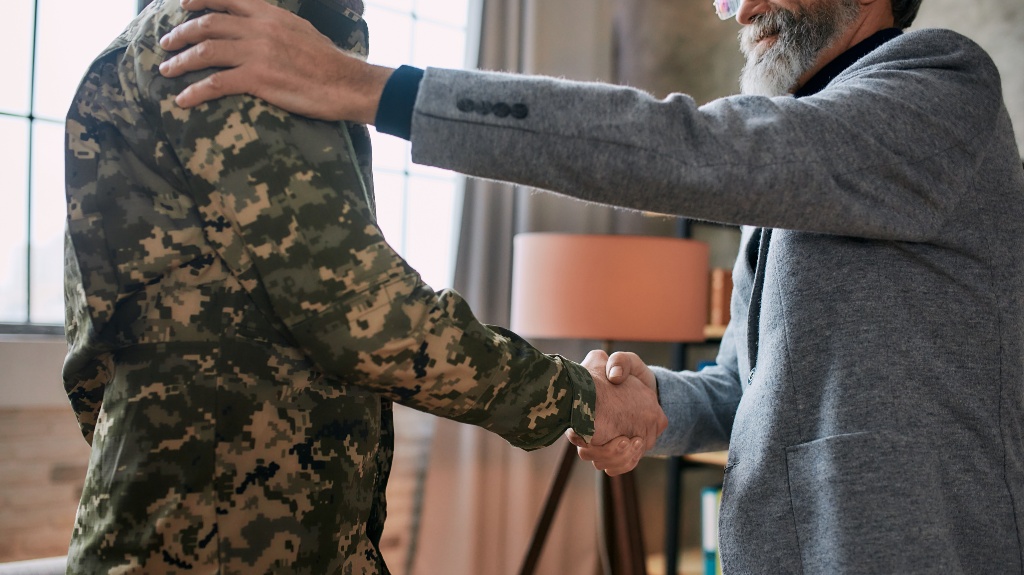 veteran shakes hands with lawyer
