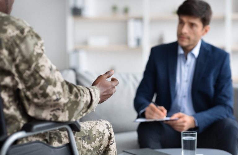 disabled black man military veteran in wheelchair attending psychologist